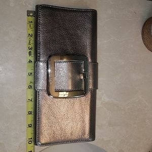 Michael Kors metallic brass colored clutch